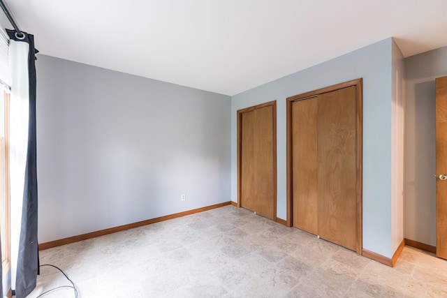 1532 E Stonehenge Drive -, Sycamore, IL 60178 - unfurnished bedroom featuring two closets and baseboards
