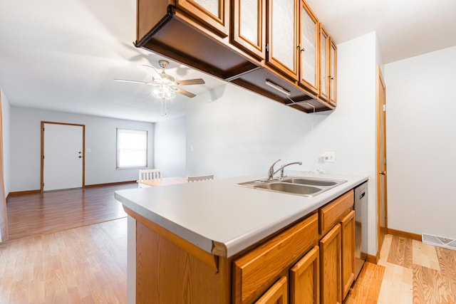 1532 E Stonehenge Drive -, Sycamore, IL 60178 - kitchen with light wood-style flooring, a ceiling fan, brown cabinets, and light countertops