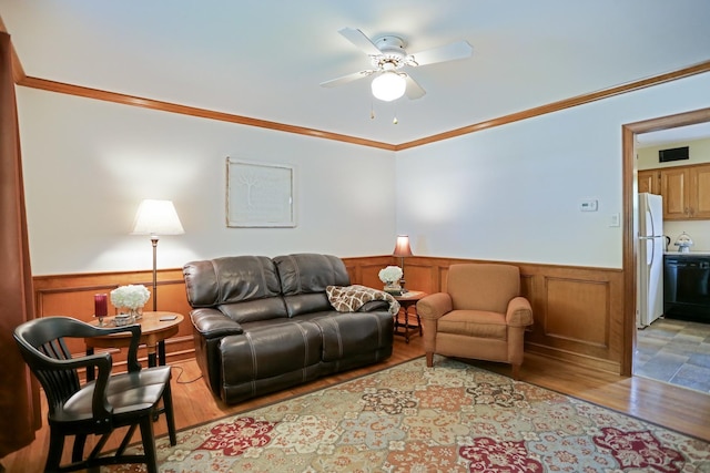 611 S 10th Ave, Saint Charles, IL 60174 - living room featuring wainscoting, crown molding, a ceiling fan, and light wood-type flooring