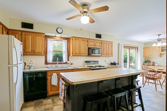 611 S 10th Ave, Saint Charles, IL 60174 - kitchen with white appliances, ceiling fan, healthy amount of natural light, and backsplash