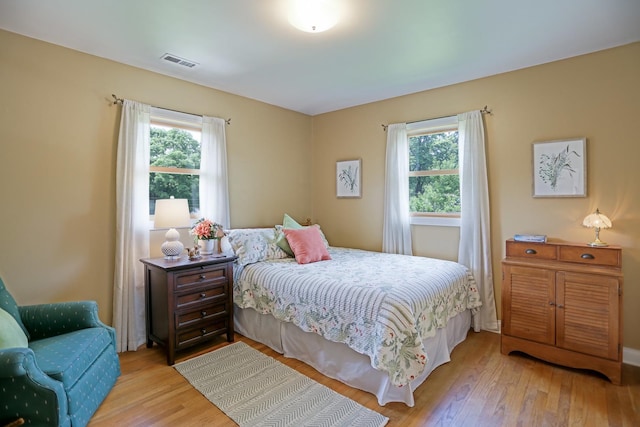 611 S 10th Ave, Saint Charles, IL 60174 - bedroom featuring multiple windows and wood finished floors