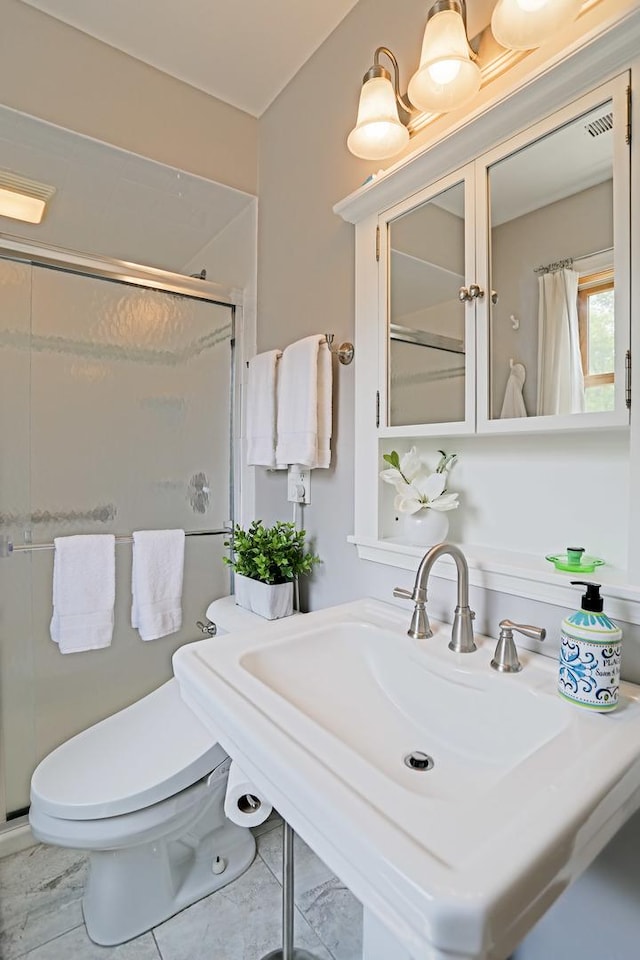 611 S 10th Ave, Saint Charles, IL 60174 - bathroom featuring a shower stall and a sink