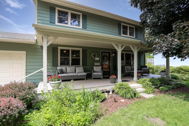 611 S 10th Ave, Saint Charles, IL 60174 - view of front facade with an outdoor hangout area, a porch, and a garage