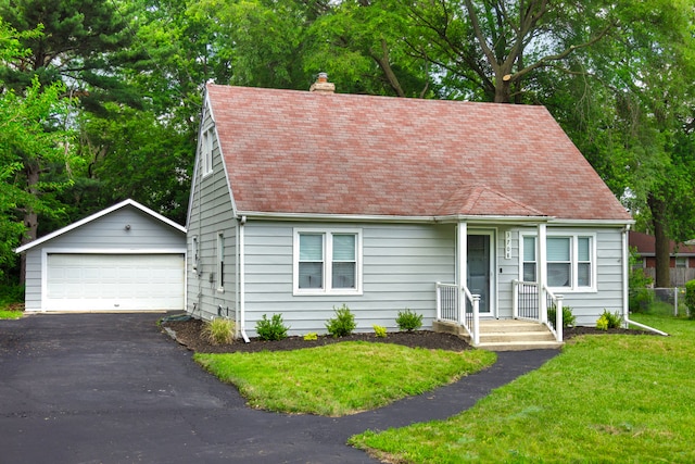 3708 W 162nd Pl, Markham, IL 60428 - cape cod-style house featuring an outdoor structure, a detached garage, a chimney, a front lawn, and roof with shingles