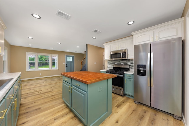 3708 W 162nd Pl, Markham, IL 60428 - kitchen with appliances with stainless steel finishes, wooden counters, white cabinets, green cabinetry, and light wood finished floors