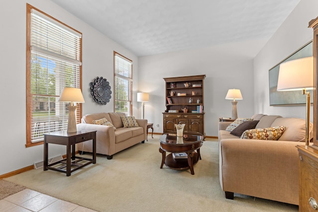 12169 Ayrshire Ln, Loves Park, IL 61111 - living room featuring baseboards and light tile patterned flooring