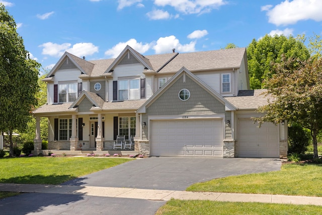 1284 Mcdole Dr, Sugar Grove, IL 60554 - view of front of property featuring driveway, a front yard, stone siding, a garage, and a porch