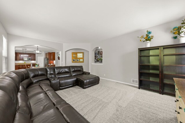 1284 Mcdole Dr, Sugar Grove, IL 60554 - carpeted living room featuring arched walkways and baseboards