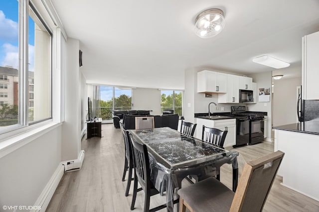 20 N Tower Rd Unit 3G, Oak Brook, IL 60523 - dining area featuring light wood finished floors and baseboards