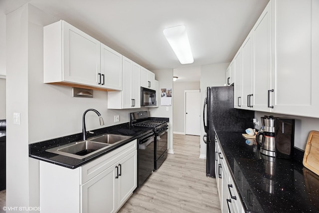 20 N Tower Rd Unit 3G, Oak Brook, IL 60523 - kitchen featuring black appliances, a sink, light wood-type flooring, and white cabinetry