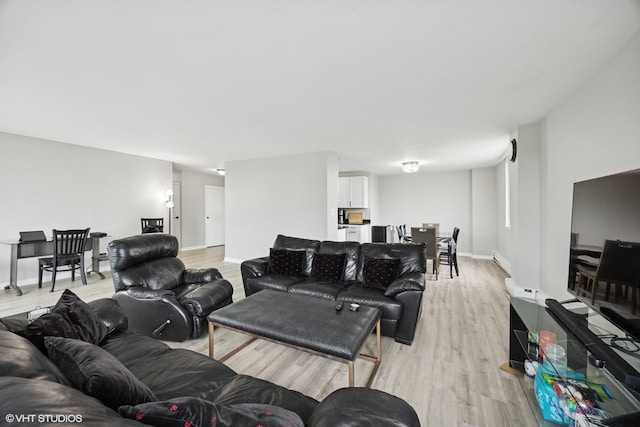 20 N Tower Rd Unit 3G, Oak Brook, IL 60523 - living area featuring light wood-type flooring, baseboards, and a baseboard radiator