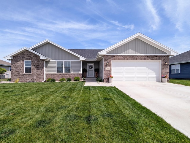 1785 Condor Dr, Manteno, IL 60950 - ranch-style house with brick siding, a garage, a front lawn, and driveway