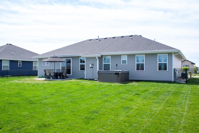 1785 Condor Dr, Manteno, IL 60950 - rear view of property featuring a hot tub, a patio, and a shingled roof