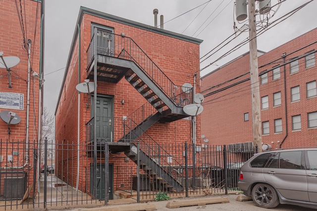 2413 W Taylor St, Chicago, IL 60612 - view of property with a fenced front yard and stairs