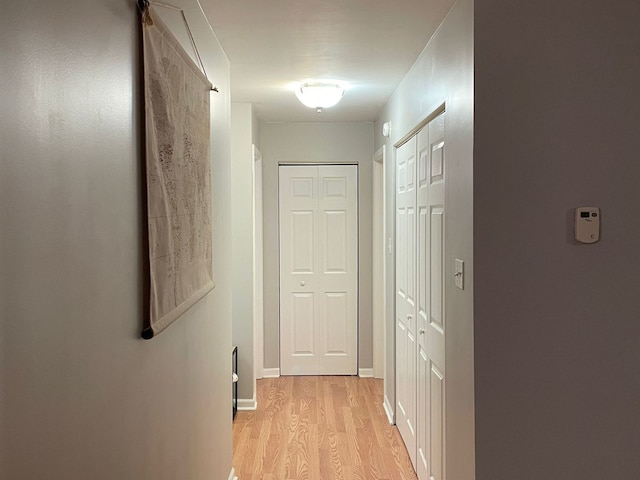 1188 Royal Glen Dr Unit 211, Glen Ellyn, IL 60137 - corridor featuring light wood-style flooring and baseboards