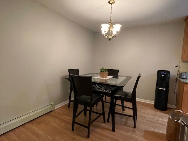 1188 Royal Glen Dr Unit 211, Glen Ellyn, IL 60137 - dining area with baseboard heating, a chandelier, light wood-style flooring, and baseboards