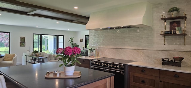 532 W Merri Oaks Rd, Barrington Hills, IL 60010 - kitchen featuring range with two ovens, wall chimney exhaust hood, beamed ceiling, decorative backsplash, and open floor plan