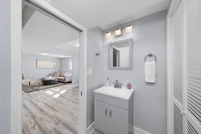 473 W Verret St, Elmhurst, IL 60126 - bathroom with vanity, wood finished floors, and baseboards