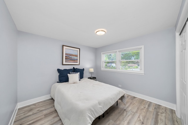 473 W Verret St, Elmhurst, IL 60126 - bedroom featuring baseboards and light wood-type flooring