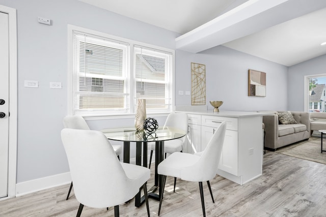 473 W Verret St, Elmhurst, IL 60126 - dining space with light wood-style flooring, baseboards, and vaulted ceiling