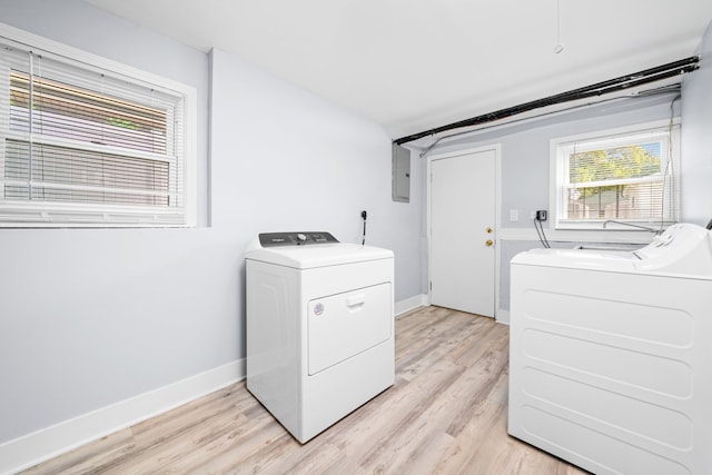 473 W Verret St, Elmhurst, IL 60126 - laundry room with washer and dryer, light wood-style floors, electric panel, and baseboards