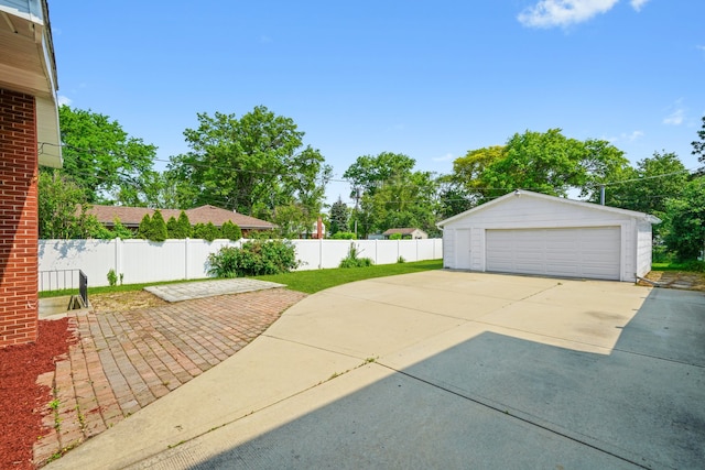 473 W Verret St, Elmhurst, IL 60126 - view of patio featuring a garage and an outdoor structure