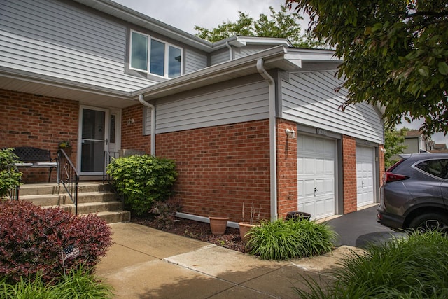 7902 160th St, Tinley Park, IL 60477 - view of side of home with brick siding, an attached garage, and asphalt driveway