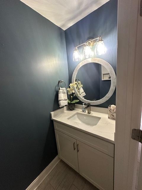 7902 160th St, Tinley Park, IL 60477 - bathroom featuring vanity, wood finished floors, and baseboards