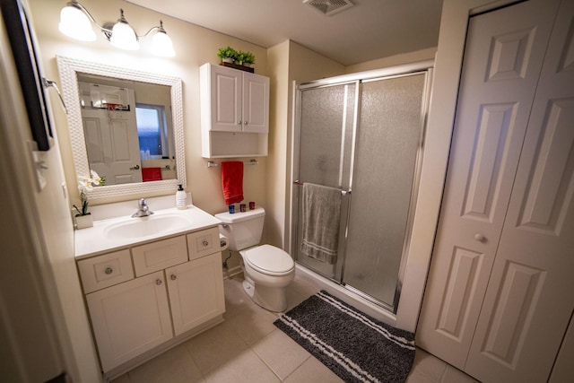 7902 160th St, Tinley Park, IL 60477 - bathroom with toilet, vanity, a shower stall, tile patterned flooring, and a closet