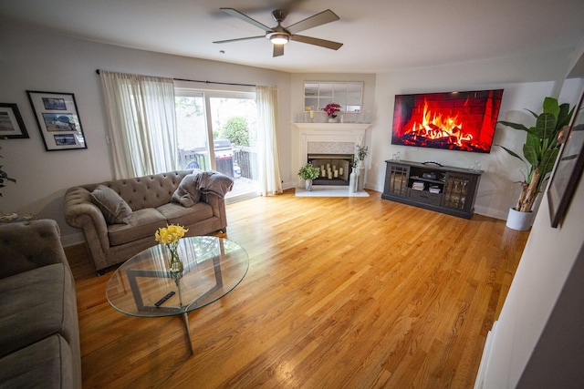 7902 160th St, Tinley Park, IL 60477 - living area with ceiling fan, a fireplace, light wood finished floors, and baseboards