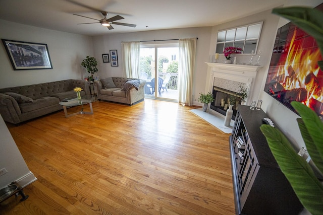 7902 160th St, Tinley Park, IL 60477 - living room featuring ceiling fan, a high end fireplace, and wood finished floors