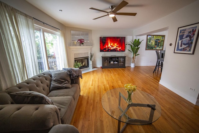 7902 160th St, Tinley Park, IL 60477 - living area featuring a ceiling fan, a high end fireplace, baseboards, and light wood-type flooring