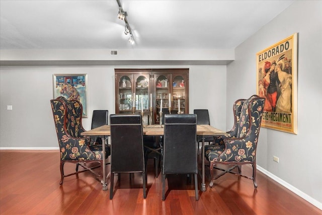 1534 Mcdaniels Ave Unit 4B, Highland Park, IL 60035 - dining area featuring wood finished floors, baseboards, and rail lighting