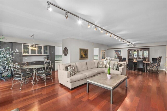1534 Mcdaniels Ave Unit 4B, Highland Park, IL 60035 - living room featuring rail lighting and wood finished floors