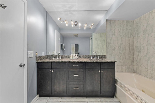1534 Mcdaniels Ave Unit 4B, Highland Park, IL 60035 - full bathroom with a whirlpool tub, double vanity, tile patterned floors, and baseboards
