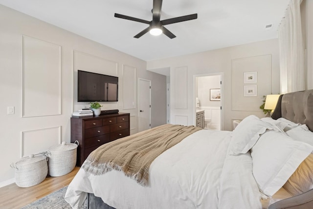 3528 N Fremont St Unit 2, Chicago, IL 60657 - bedroom featuring wood finished floors, ensuite bathroom, and a ceiling fan