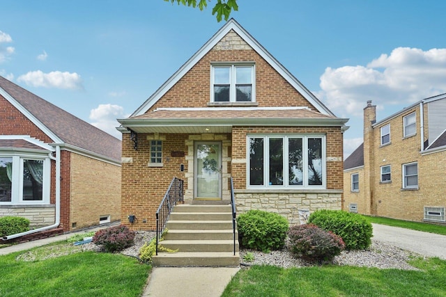 7517 N Oketo Ave, Chicago, IL 60631 - bungalow-style house featuring stone siding, brick siding, and roof with shingles