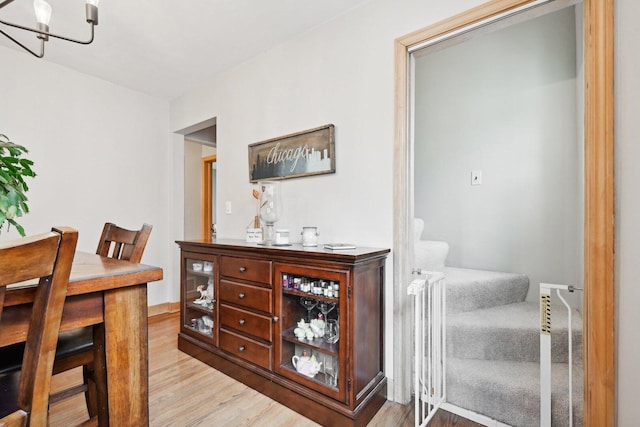 7517 N Oketo Ave, Chicago, IL 60631 - dining space featuring light wood-style flooring and stairs