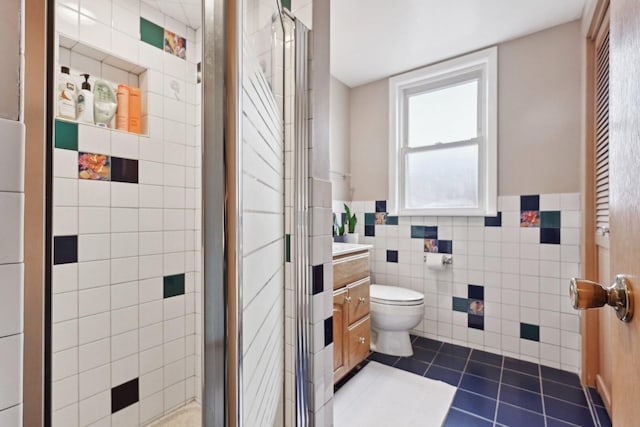 7517 N Oketo Ave, Chicago, IL 60631 - full bathroom with tile walls, tile patterned floors, a shower stall, vanity, and toilet