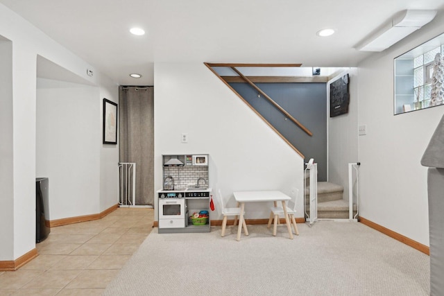 7517 N Oketo Ave, Chicago, IL 60631 - recreation room with recessed lighting, baseboards, light carpet, and light tile patterned floors