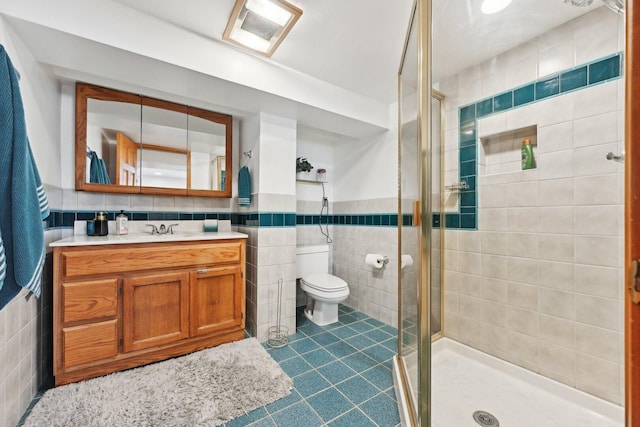 7517 N Oketo Ave, Chicago, IL 60631 - full bathroom with tile walls, vanity, a shower stall, tile patterned flooring, and toilet