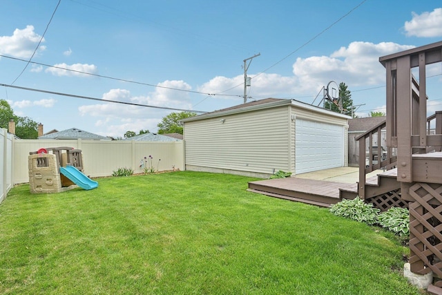 7517 N Oketo Ave, Chicago, IL 60631 - view of yard with a wooden deck, a detached garage, an outbuilding, and a playground