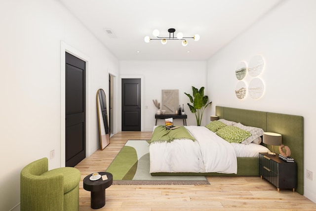 2636 W Evergreen Ave Unit 1, Chicago, IL 60622 - bedroom featuring light wood-style flooring and a chandelier