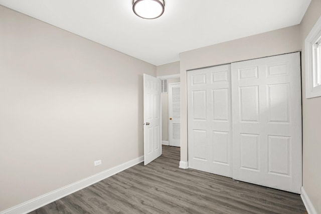 232 Camden Dr, Steger, IL 60475 - unfurnished bedroom featuring wood finished floors, baseboards, and a closet