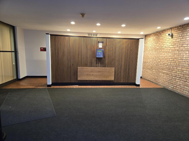 5600 Hillcrest Ln Unit 2L, Lisle, IL 60532 - reception area with brick wall and recessed lighting