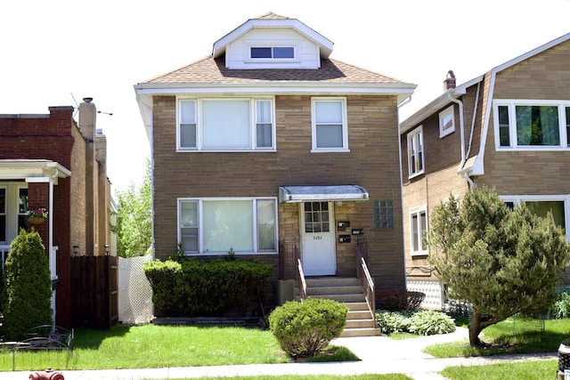 5352 N Magnet Ave, Chicago, IL 60630 - view of front of house featuring roof with shingles