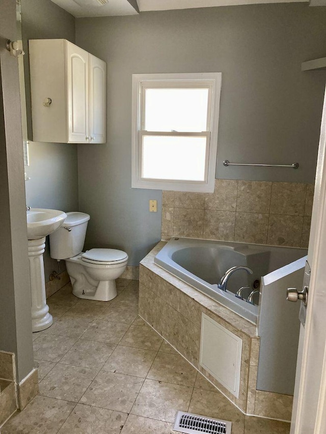 5352 N Magnet Ave, Chicago, IL 60630 - full bathroom with a bath, toilet, and tile patterned floors