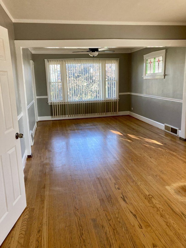 5352 N Magnet Ave, Chicago, IL 60630 - unfurnished room featuring wood finished floors, ornamental molding, a ceiling fan, and baseboards