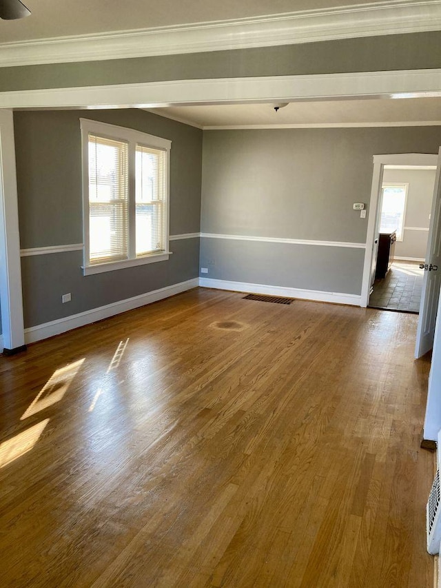 5352 N Magnet Ave, Chicago, IL 60630 - spare room with dark wood-style floors, crown molding, and baseboards