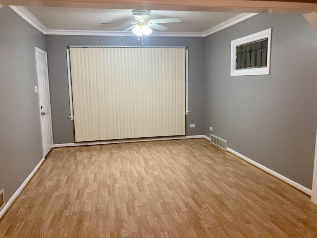 5352 N Magnet Ave, Chicago, IL 60630 - spare room featuring wood finished floors, ornamental molding, baseboards, and a ceiling fan